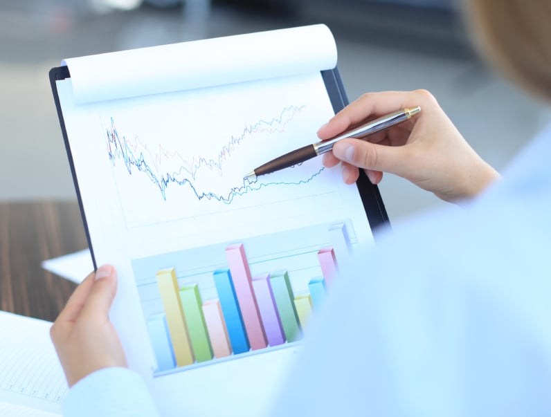 businessman holding charts