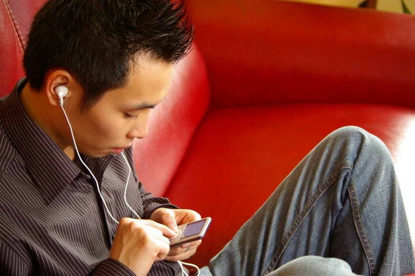 man listening to music, ear buds, headphones
