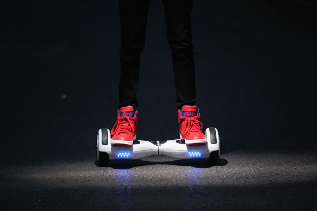 A youth poses as he rides a hoverboard, which are also known as self-balancing scooters and balance boards, on October 13, 2015 in Knutsford, England. The British Crown Prosecution Service have declared that the devices are illegal as they are are too unsafe to ride on the road, and too dangerous to ride on the pavement. (Photo by Christopher Furlong/Getty Images)