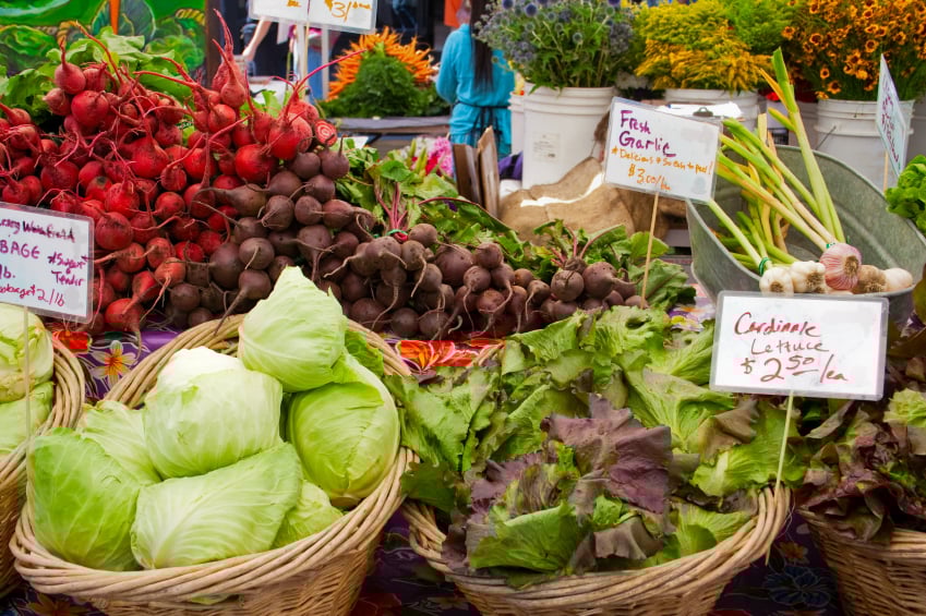 Baskets of fresh lettuce, beets, and cabbage
