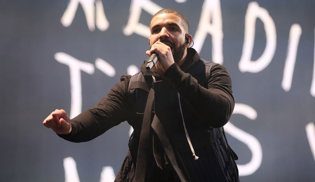 Drake performing on stage.