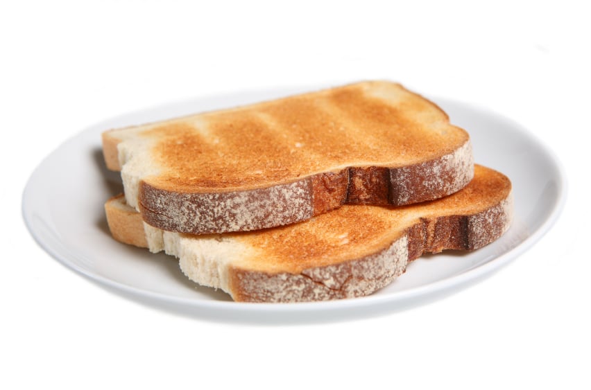 two slices of plain toast on a white plate