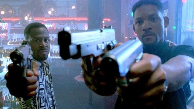 Martin Lawrence and Will Smith hold up guns in Bad Boys