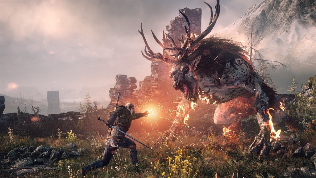 Geralt the witcher uses a fire spell on a giant fantasy beast.
