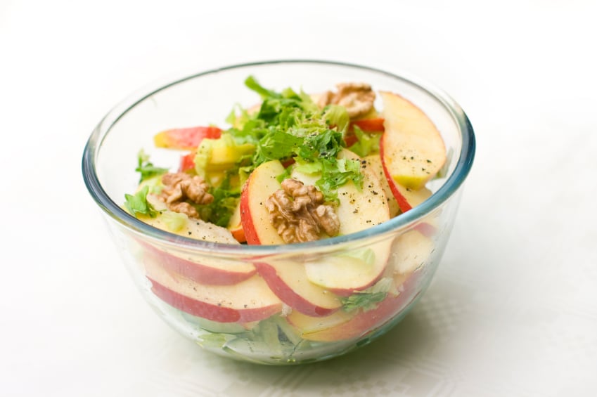 Waldorf salad with greens, apples, and walnuts