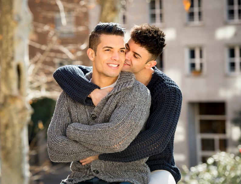 a gay couple hugging a gay couple hugging