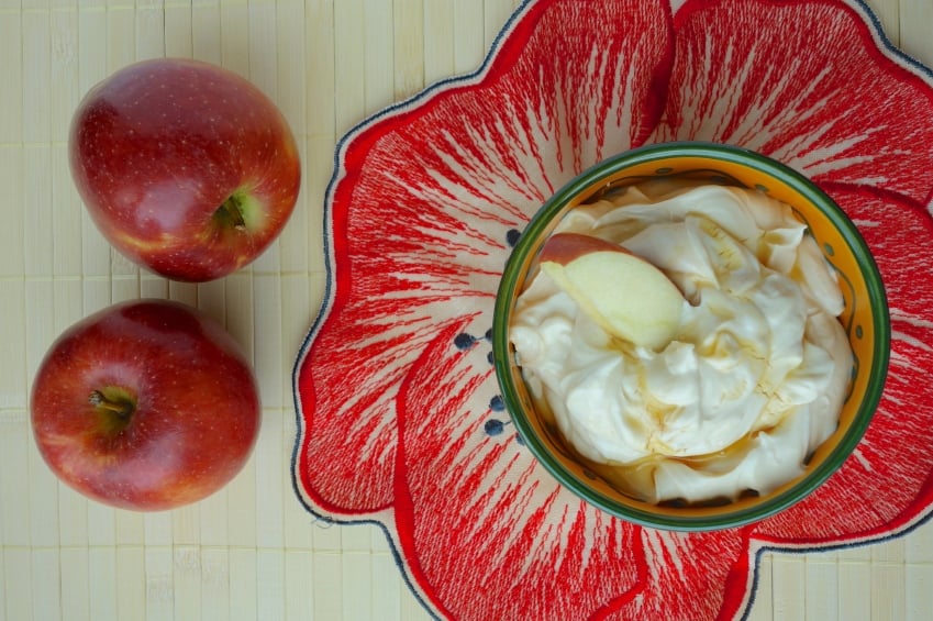 overhead shot of a bowl of yogurt with honey and apples
