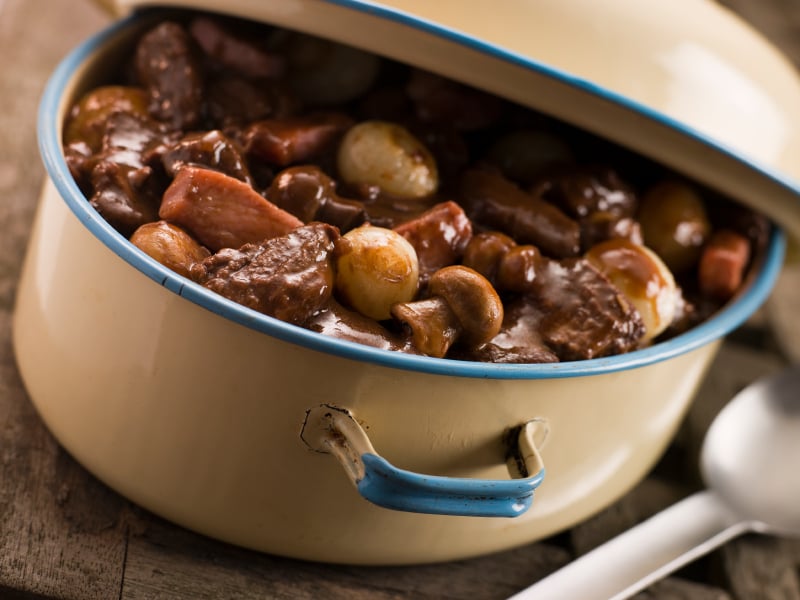 Dutch oven filled with braised beef and vegetables
