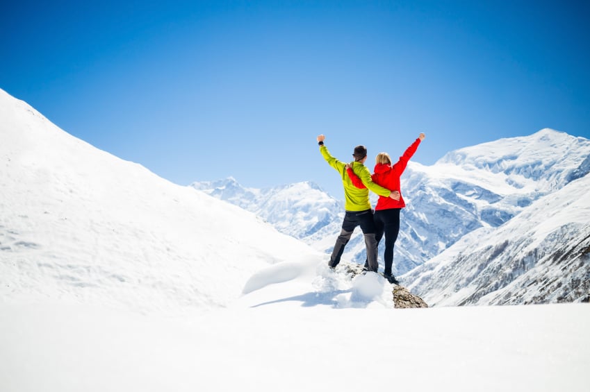 couple climbing a mountain together