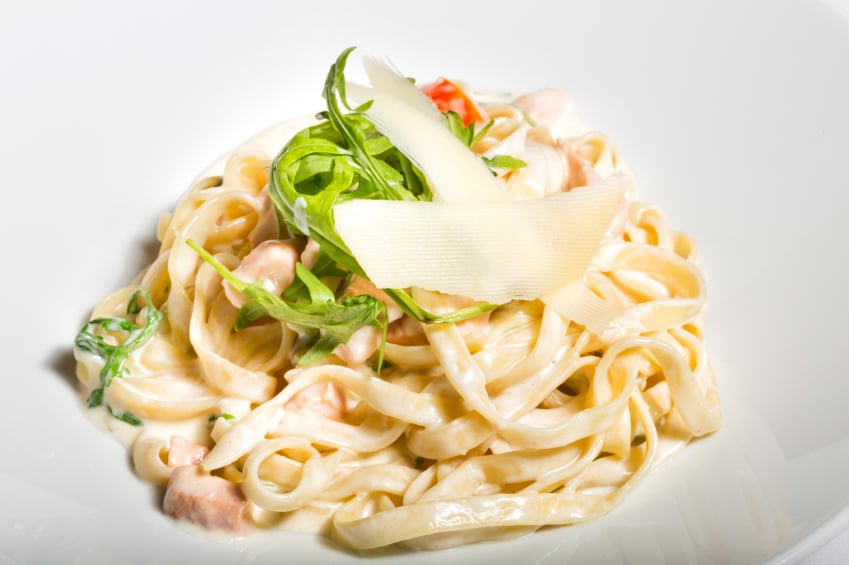 white sauce salmon pasta with white background