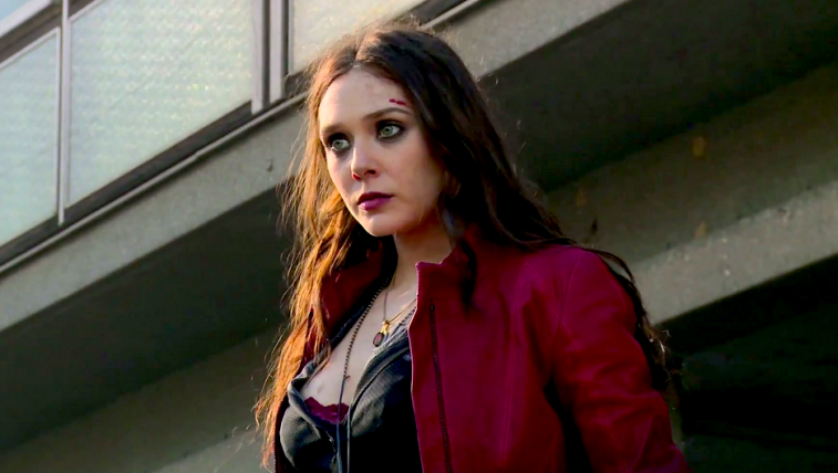 Scarlett Witch stands in a red jacket. 