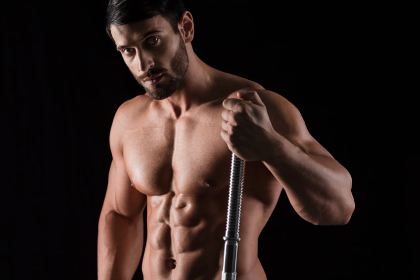 close shot of a fit man holding end of a barbell close shot of a fit man holding end of a barbell