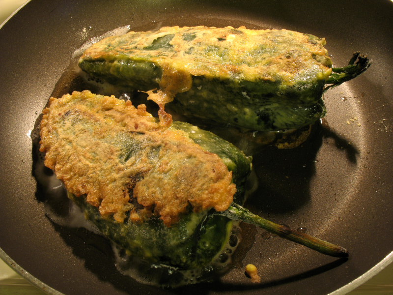 Chile Rellenos frying in a pan