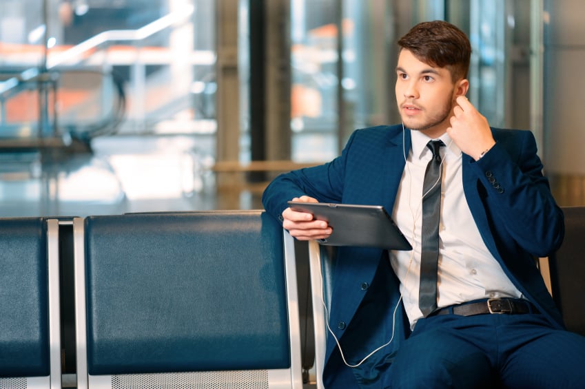 businessman listening to music with earphones