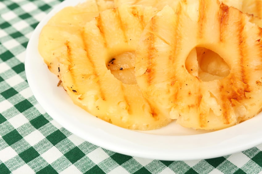 grilled pineapple served in a white dish