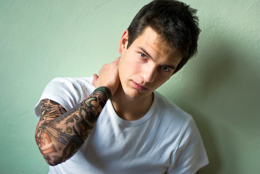 photo of a young man with tatoo