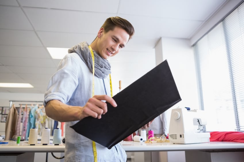 Happy student looking at notebook