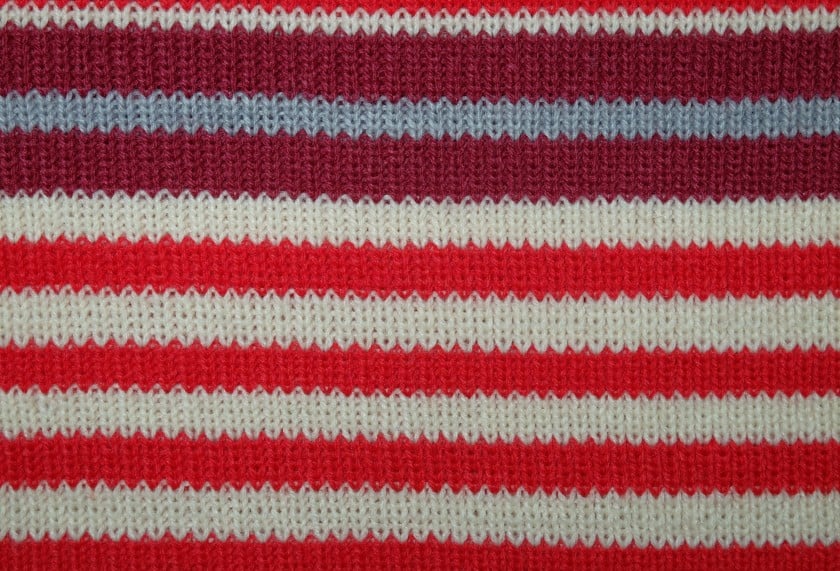 red and white colored woolen fabric