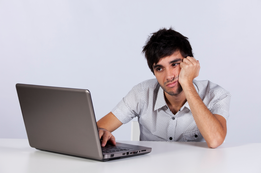 Young working with his laptop