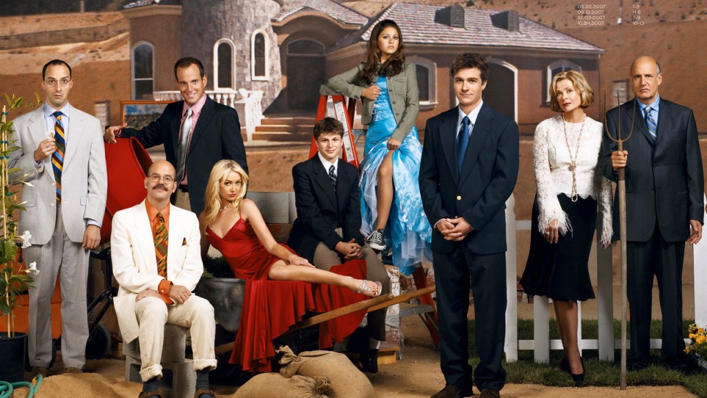 The Bluths posing in front of a home