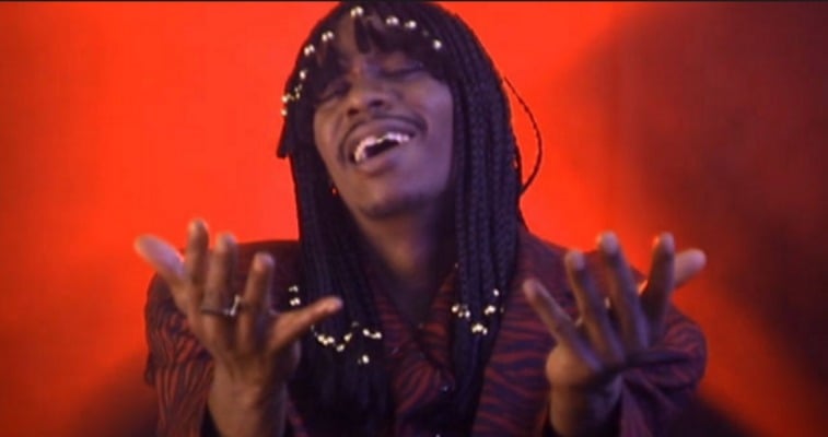 Dave Chappelle as Rick James is singing.