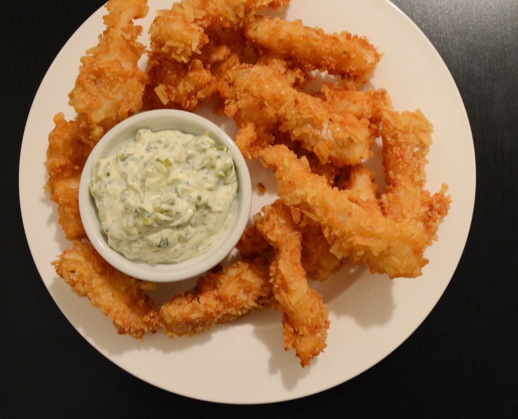 plate of potato chip crusted, beer -battered fish with dill tartar sauce