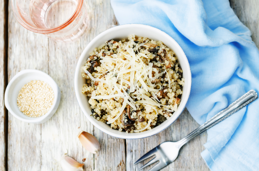 bowl of quinoa with garlic, mushrooms, and Parmesan cheese