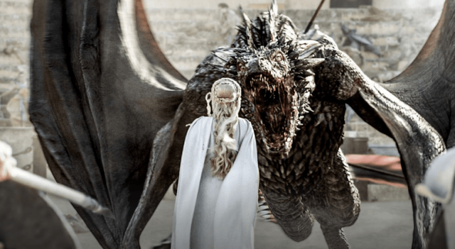 Dragons stare down Daenerys Targaryen in a scene from HBO's Game of Thrones