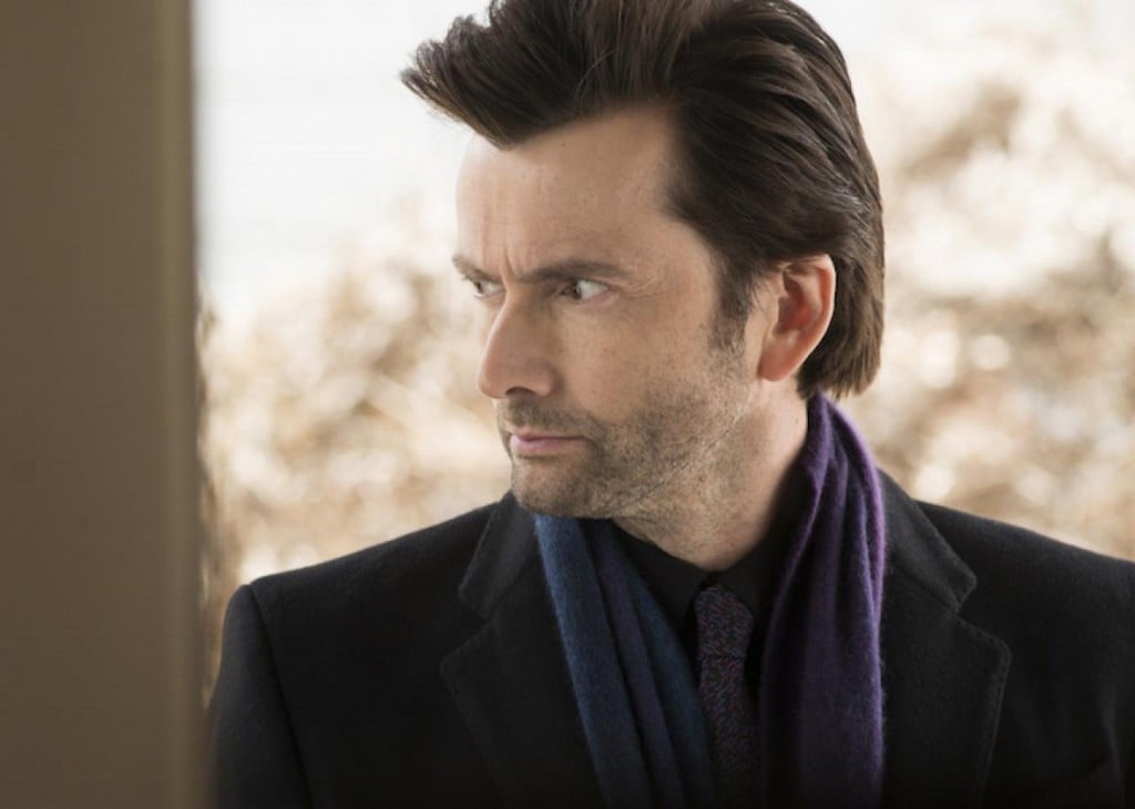 David Tennant as Killgrave, wearing a purple scarf and looking to his right