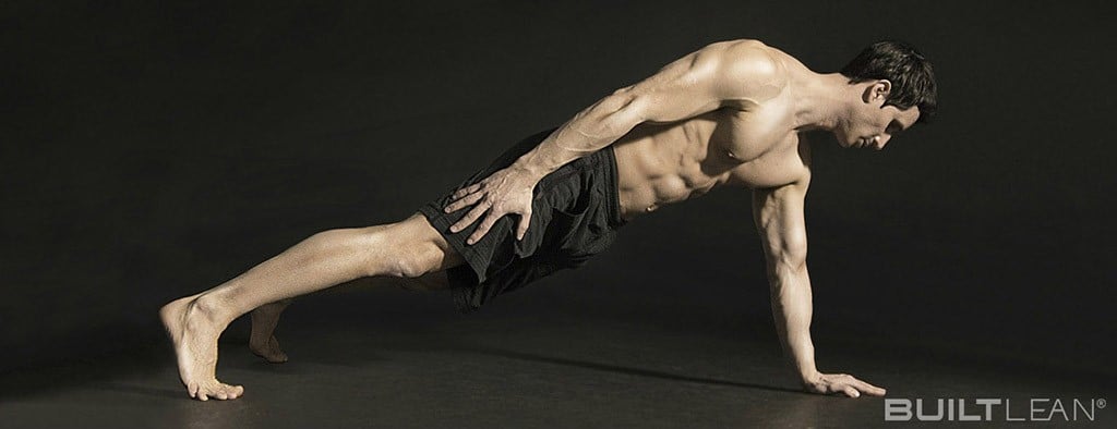 shot of Marc Perry doing one-arm push-ups on a black background