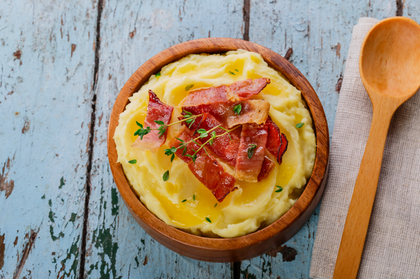 wooden bowl filled with mashed potatoes and bacon