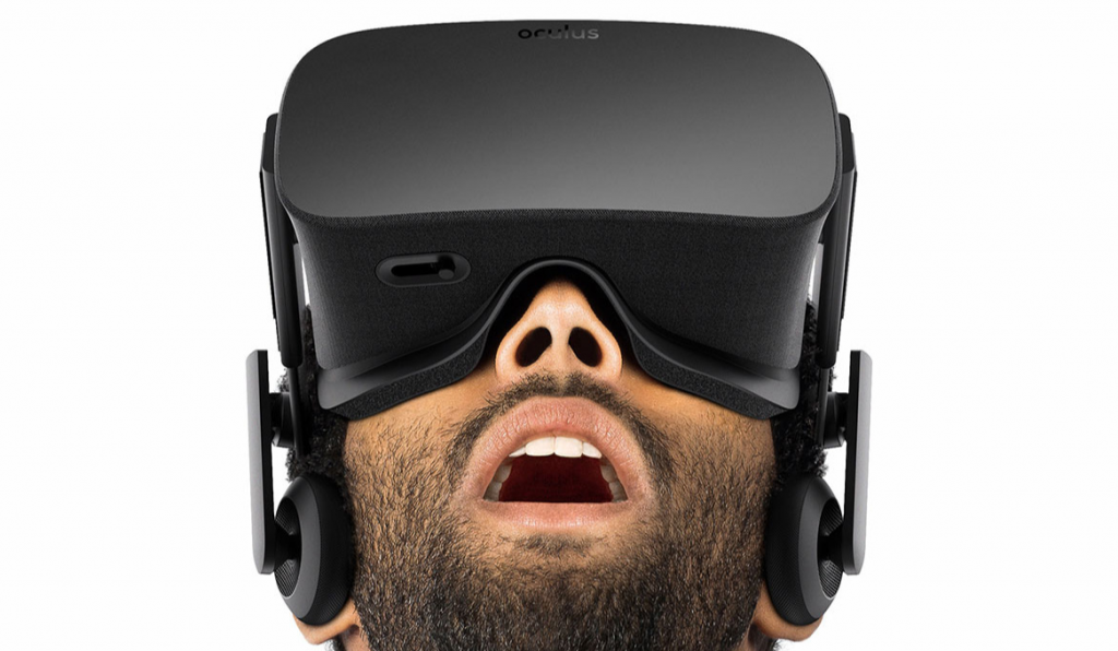 A man stares in awe as he wears a VR headset.