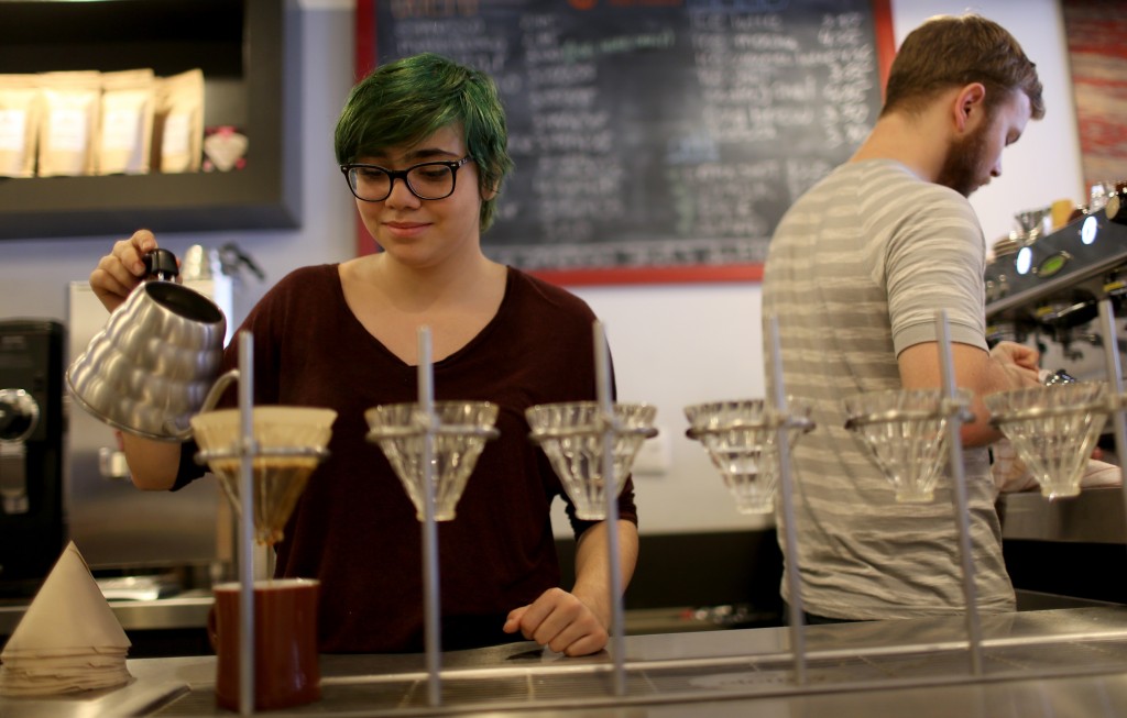 barista making coffee