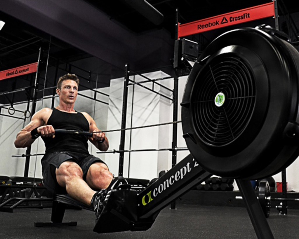 Personal trainer Ron Mathews working out on a row machine