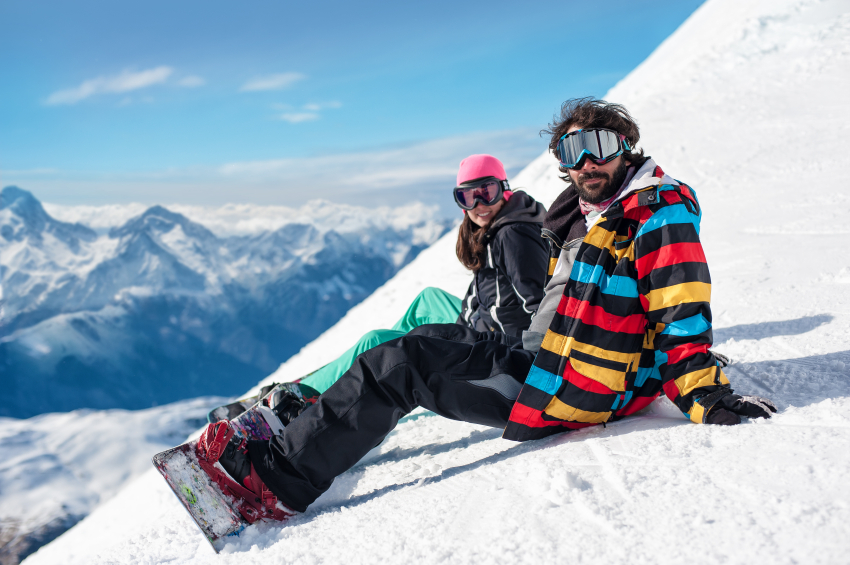 couple enjoying on snowy mountain