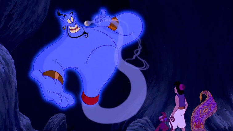 The genie speaking to Aladdin, Abu, and the magic carpet Aladdin and Abu look up at Genie while riding the magic carpet in Aladdin