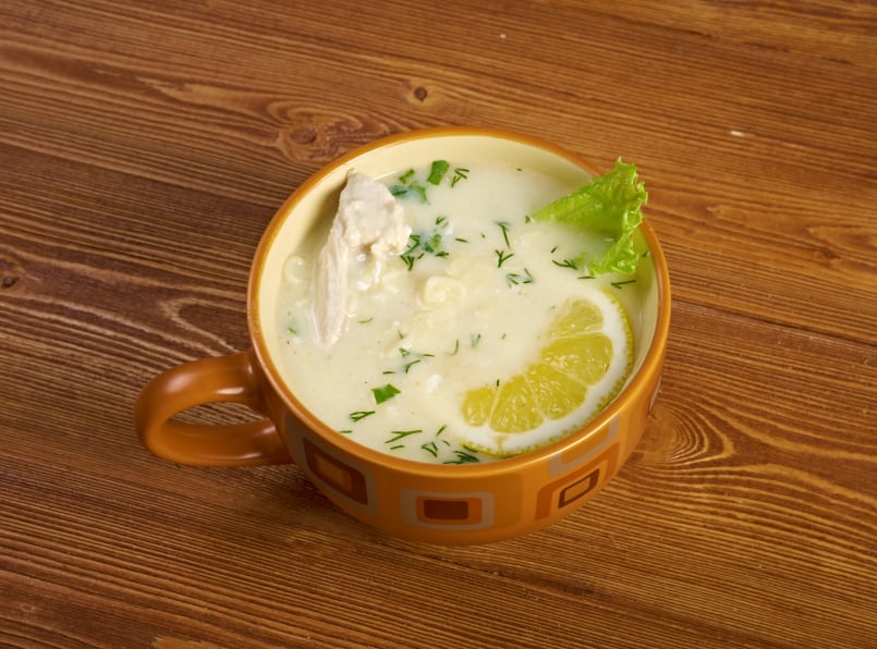 Avgolemono, a type of greek lemon and egg soup with chcien in a muge