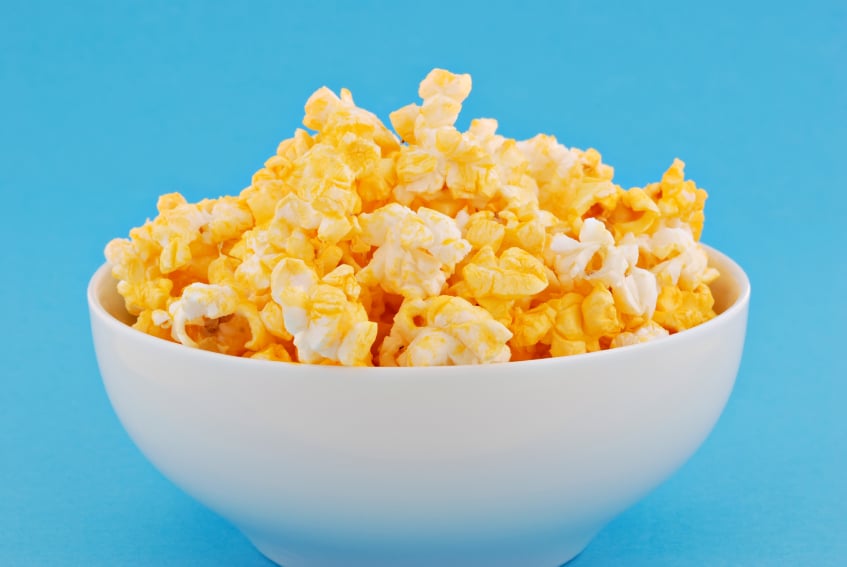 white bowl filled with buttered popcorn