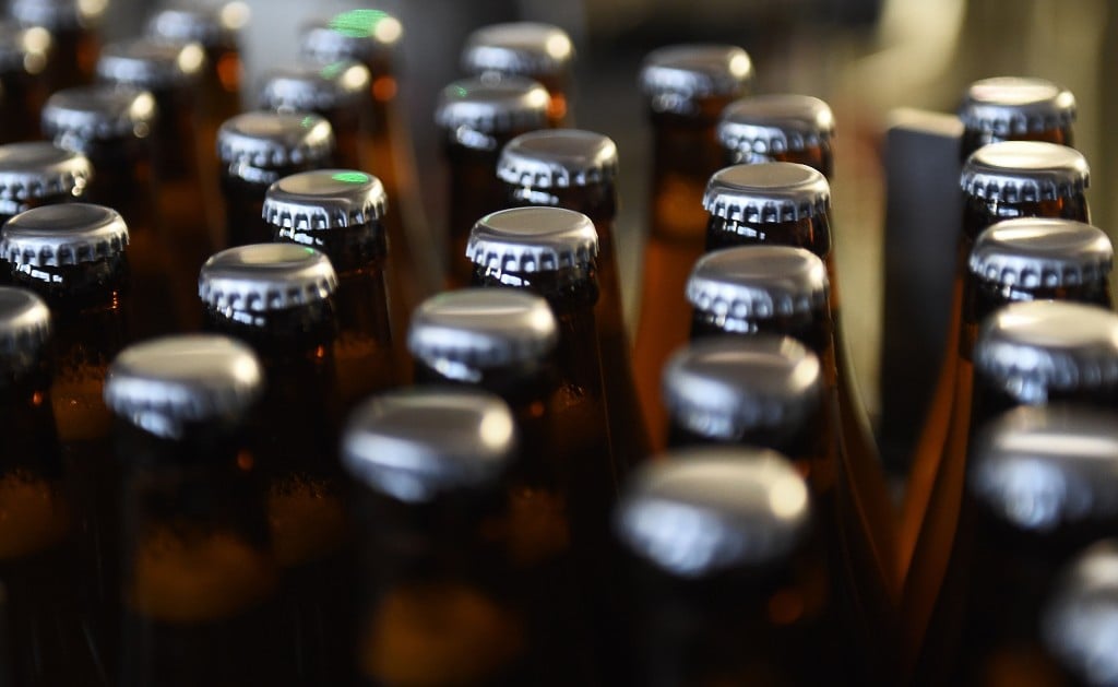 beer bottles in assembly line