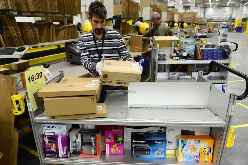 Amazon warehouse workers pick orders