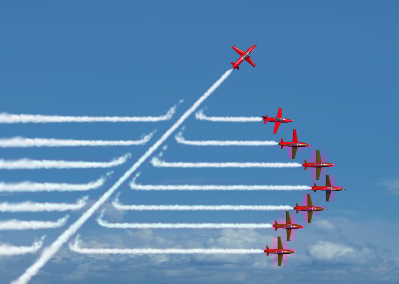 group of ariplanes making smoke as a metaphor