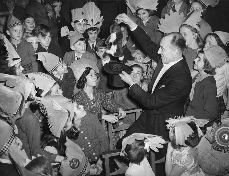 Magician pulling a rabbit from a hat