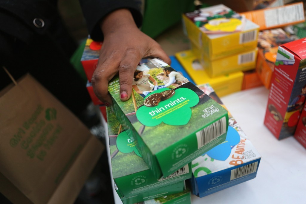 Person buying girl scout cookies Person buying girl scout cookies
