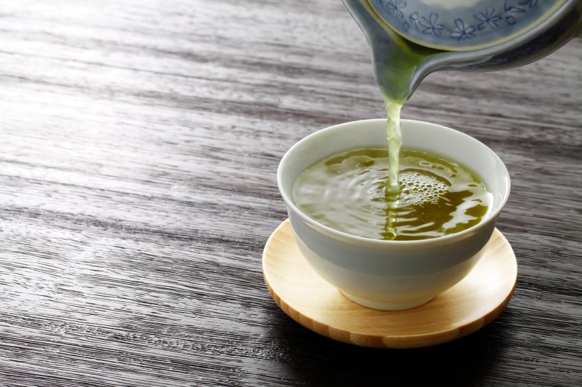 pouring a cup of green tea