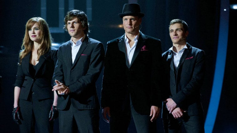Isla Fisher, Jesse Eisenberg, Woody Harrelson, and Dave Franco on stage in dress clothes in 'Now You See Me'