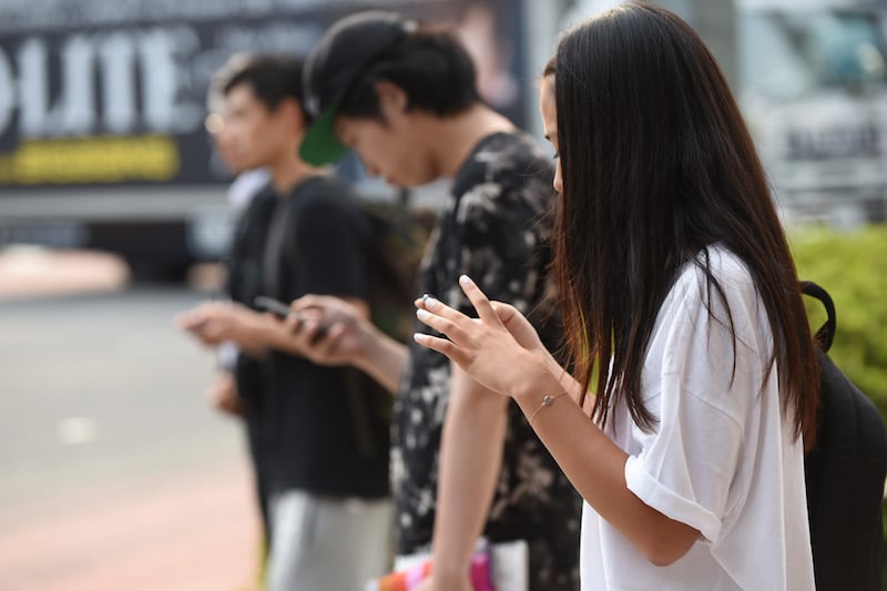 People using smartphones