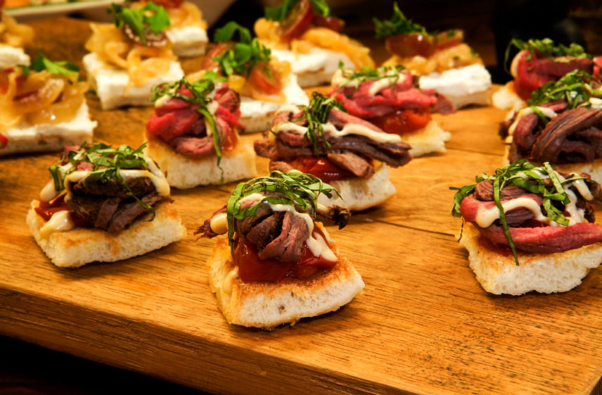 open-face sandwiches with roast beef tenderloin and microgreens