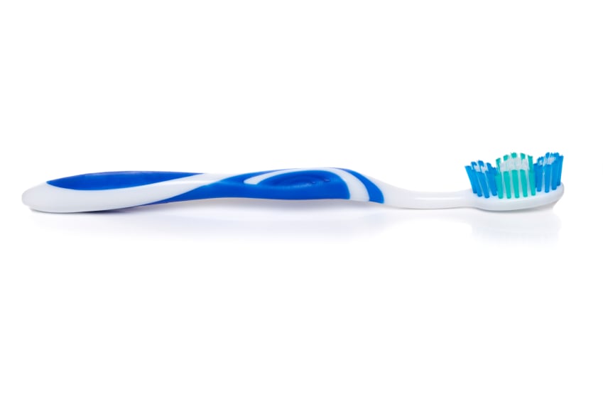 Blue and white tooth brush