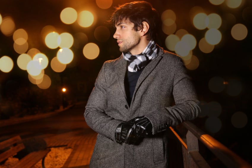 young man wearing long winter coat