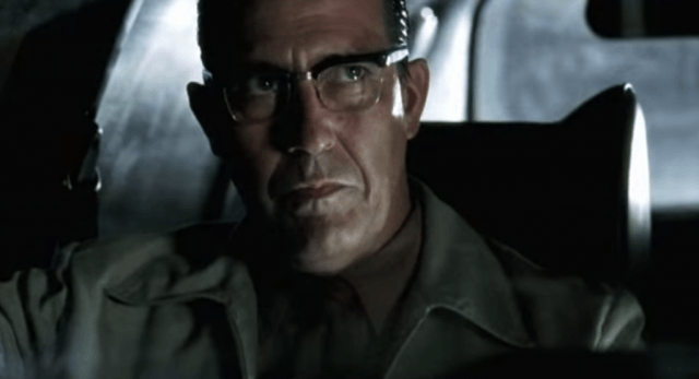 Ciaran Hinds wears glasses and looks up while sitting in a car Ciaran Hinds wears glasses and looks up while sitting in a car
